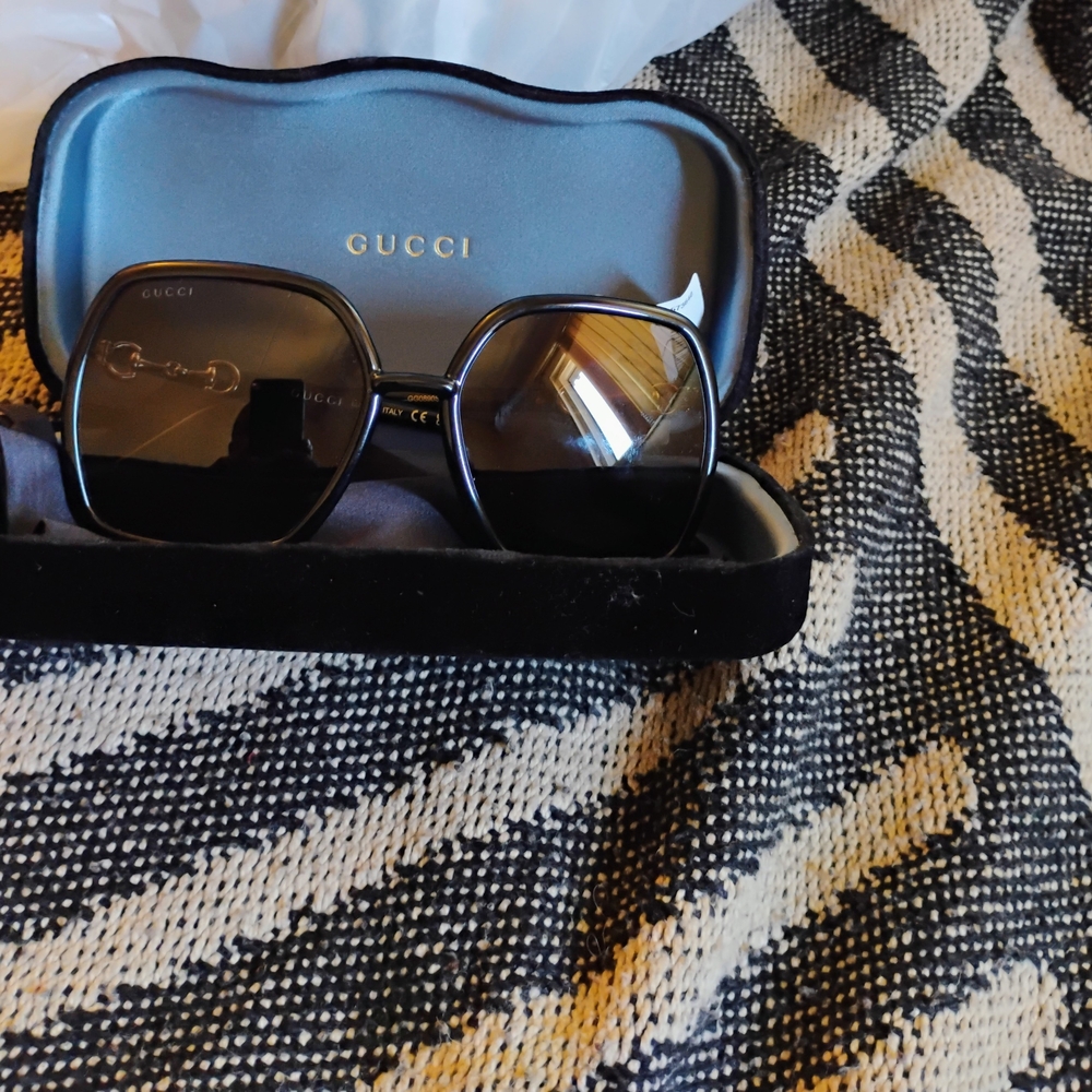 Gucci Sunglasses with Black Frame and Gold Details
